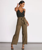 Two Tone Sleeveless V-Neck Paperbag Jumpsuit will help you dress the part in stylish holiday party attire, an outfit for a New Year’s Eve party, & dressy or cocktail attire for any event.