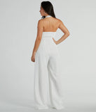 The Getaway Vibes Wide-Leg Pinstripe Woven Jumpsuit is an elevated one-piece that blends sleek sophistication with playful charm, perfect for nailing casual or formal outfits.