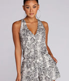 Sassy Satin Snake Print Romper will help you dress the part in stylish holiday party attire, an outfit for a New Year’s Eve party, & dressy or cocktail attire for any event.