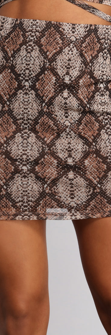 Sultry And Stunning Snake Print Mini Skirt provides a stylish start to creating your best summer outfits of the season with on-trend details for 2023!