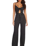 Stand Out Striped Tie Front Jumpsuit will help you dress the part in stylish holiday party attire, an outfit for a New Year’s Eve party, & dressy or cocktail attire for any event.