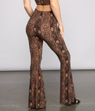 Charming And Chic Snake Print Flared Pants provides a stylish start to creating your best summer outfits of the season with on-trend details for 2023!