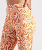 Total Jetsetter Swirl Print Flare Pants is a fire pick to create 2023 festival outfits, concert dresses, outfits for raves, or to complete your best party outfits or clubwear!