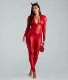 Adult women’s devil costume from Windsor features a red faux leather mock neck catsuit with long sleeves, devil horn headband, a small shiny red bag, and nude block heels.
