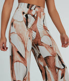 Refresh your fall closet with stylish women's pants like the Like A Work Of Art Abstract Wide Leg Palazzo Pants in a sleek fabric and a pant leg style that makes your look unique.