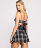 Poised in Plaid Tie Back Romper provides a stylish start to creating your best summer outfits of the season with on-trend details for 2023!