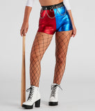 Red and blue metallic costume shorts styled as a women’s comic book villain harlequin costume styled with a chain belt, large gage fishnet tights, white lug sole booties, and baseball bat
