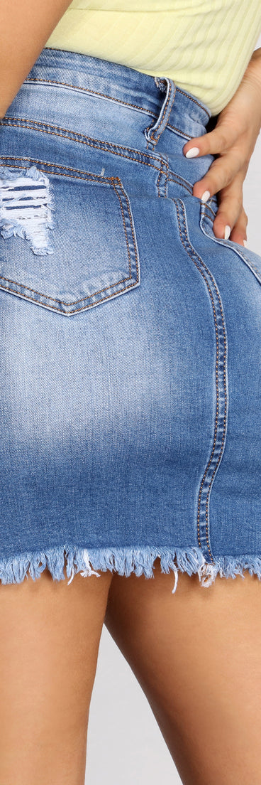 With fun and flirty details, Super Distressed Denim Mini Skirt shows off your unique style for a trendy outfit for the summer season!