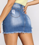 With fun and flirty details, Super Distressed Denim Mini Skirt shows off your unique style for a trendy outfit for the summer season!