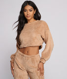 You’ll look stunning in the Cozy Cutie Sherpa Pajama Crop Top when paired with its matching separate to create a glam clothing set perfect for parties, date nights, concert outfits, back-to-school attire, or for any summer event!