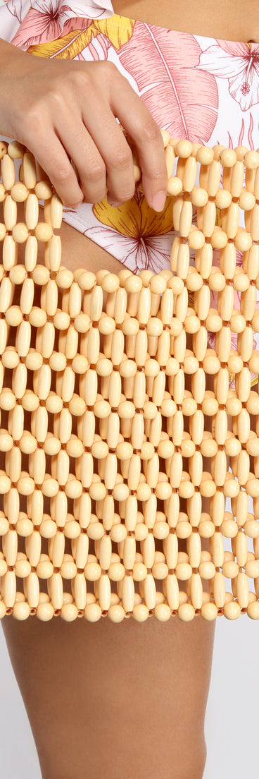 A Summer Mood Wooden Beaded Mini Tote is a trendy pick to create 2023 festival outfits, festival dresses, outfits for concerts or raves, and complete your best party outfits!