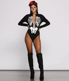 Adhesive Skeleton Body and Skeleton Iridescent Face Gems styled by Windsor as a Women's Skeleton Costume including a Rose Headband, Large Hoop Earrings, Fishnet Tights, and Black Knee High Boots