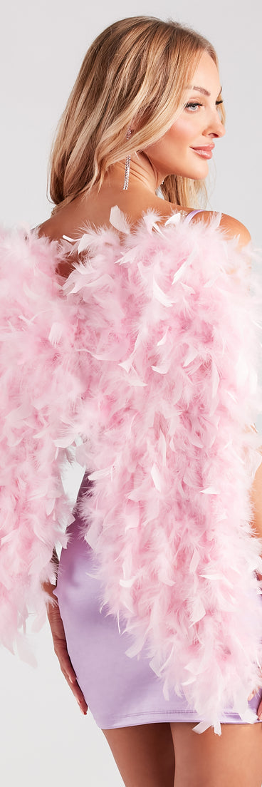Back view of pink feather angel wings styled as an adult butterfly costume