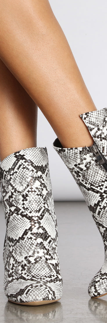 Come Thru Snake Print Clear Heeled Booties are chic ladies' shoes to complete your best 2023 outfits. They come in a variety of trendy women's shoe styles like platforms and dressy low-heels, & are available in wide widths for better comfort.